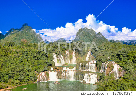 Cumulonimbus clouds over the Detian Waterfall in Nanning 127968384