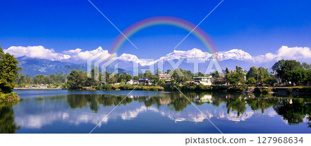 View of the Annapurna mountain range from Phewa Lake in Pokhara View of the Annapurna mountain range from Phewa Lake in Pokhara 127968634