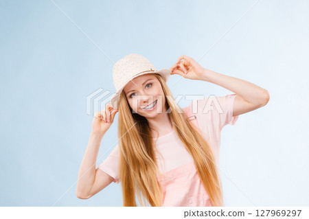Happy woman wearing summer outfit 127969297