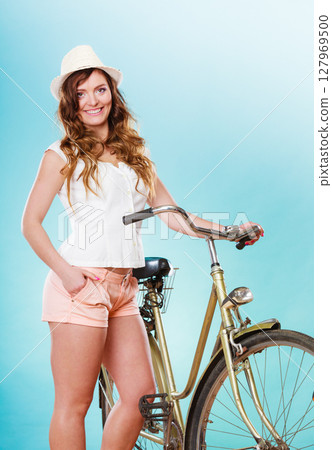 Woman with bike. Summer fashion and recreation. Woman with bike. Summer fashion and recreation. 127969500