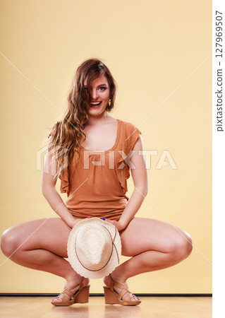 Lovely girl in summer clothes straw hat Lovely girl in summer clothes straw hat 127969507