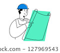 An engineer reviewing plans while wearing safety helmet, demonstrating focused construction planning and confident project management in architecture development 127969543