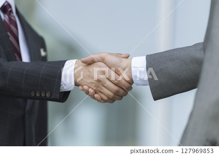 The hand of the businessman shaking hands The hand of the businessman shaking hands 127969853