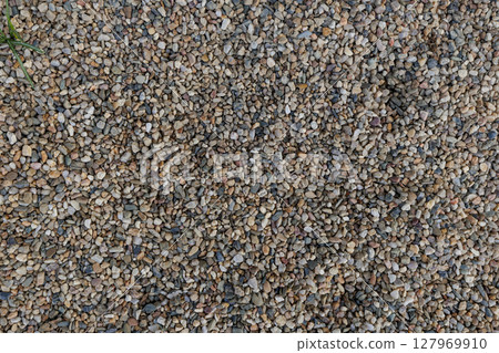 small multicolored pebbles forming a textured ground cover background copy space . Vysocany district prague 9 127969910