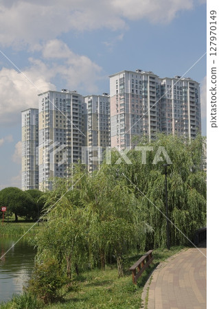 Summer sunset view of Yuzhnoe Butovo park in South Butovo district, Moscow, Russia. 127970149
