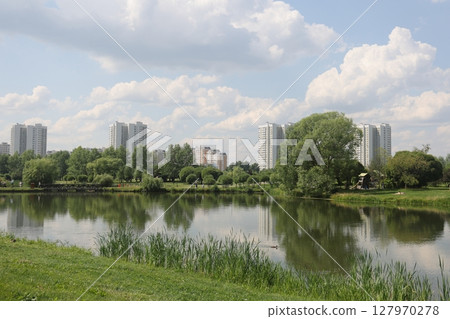 Summer sunset view of Yuzhnoe Butovo park in South Butovo district, Moscow, Russia. Summer sunset view of Yuzhnoe Butovo park in South Butovo district, Moscow, Russia. 127970278