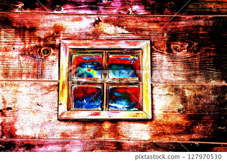 A small window in the wall of an old wooden house, changed colors. A small window in the wall of an old wooden house, changed colors. 127970530