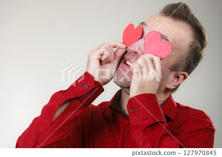 Man in love with hearts on eyes 127970845