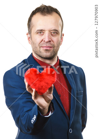 Man in suit holding heart 127970903