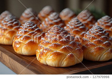 Food trading. Christmas buns in the shape of a pine cone in on a wooden trading tray on a white background. Food trading. Christmas buns in the shape of a pine cone in on a wooden trading tray on a white background. 127970998
