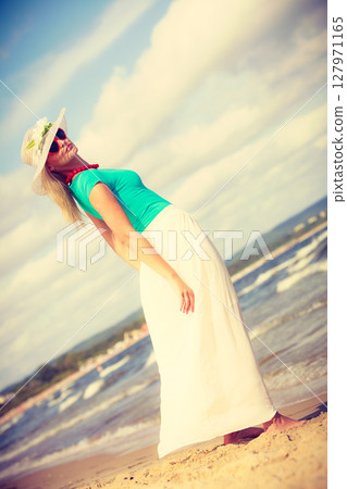 Attractive woman on the beach. Attractive woman on the beach. 127971165