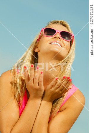 Young girl on beach. 127971181
