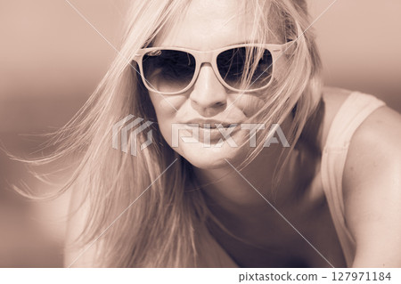 Young girl on beach. 127971184