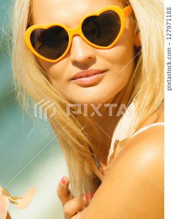 Beautiful blonde girl in sunglasses outdoor Beautiful blonde girl in sunglasses outdoor 127971188