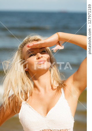Pretty girl on beach. Pretty girl on beach. 127971189
