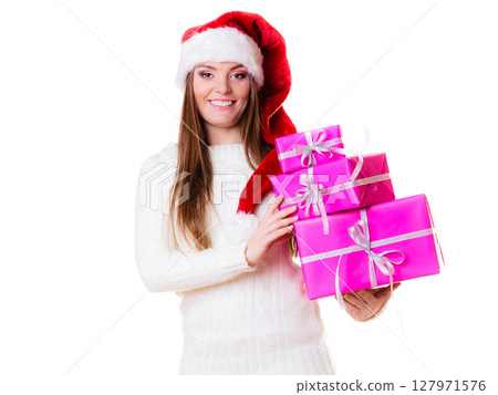 Woman santa helper hat with many pink gift boxes Woman santa helper hat with many pink gift boxes 127971576