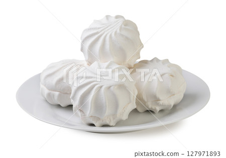 Pile of marshmallows, zephyr on a plate close-up on a white background. Isolated 127971893