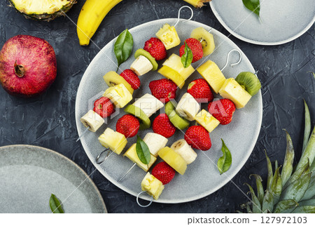 Fruit kebabs, summer snack. 127972103