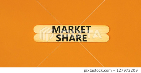 Market share symbol. Concept words Market share on beautiful wooden stick. Beautiful orange table orange background. Business and Market share concept. Copy space. 127972209