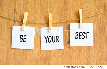 Motivational be your best symbol. Concept words Be your best on beautiful white paper on clothespin. Beautiful wooden background. Business motivational be your best concept. Copy space. Motivational be your best symbol. Concept words Be your best on beautiful white paper on clothespin. Beautiful wooden background. Business motivational be your best concept. Copy space. 127972263