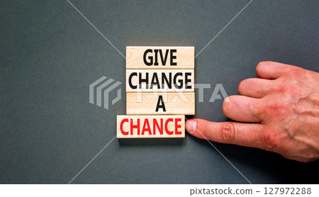 Give change a chance symbol. Concept words phrase Give change a chance on beautiful wooden blocks. Beautiful grey paper background. Businessman's hand. Business Give change a chance concept Copy space Give change a chance symbol. Concept words phrase Give change a chance on beautiful wooden blocks. Beautiful grey paper background. Businessman's hand. Business Give change a chance concept Copy space 127972288
