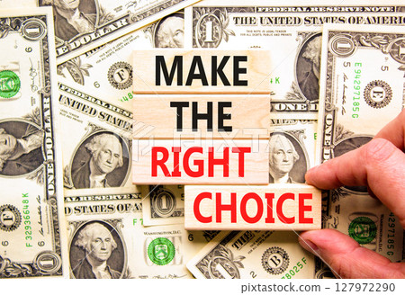 Make the right choice symbol. Concept words phrase Make the right choice on beautiful wooden blocks. Dollar bills. Beautiful dollar bills background. Business Make the right choice concept. Copy space Make the right choice symbol. Concept words phrase Make the right choice on beautiful wooden blocks. Dollar bills. Beautiful dollar bills background. Business Make the right choice concept. Copy space 127972290