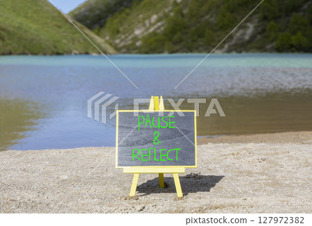 Pause and reflect symbol. Concept words Pause and reflect on beautiful blackboard. Beautiful mountain lake background. Business motivational lifestyle pause and reflect concept. Copy space. 127972382