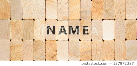 Name symbol. Concept word Name on beautiful wooden blocks. Beautiful wooden blocks background. Business, lifestyle, support and name concept. Copy space. Name symbol. Concept word Name on beautiful wooden blocks. Beautiful wooden blocks background. Business, lifestyle, support and name concept. Copy space. 127972387