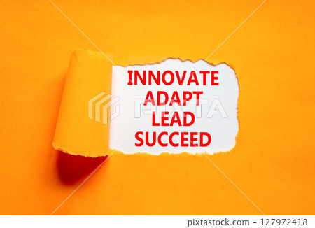 Innovate adapt lead succeed symbol. Concept words Innovate Adapt Lead Succeed on beautiful white paper. Beautiful orange background. Business innovate adapt lead succeed concept. Copy space. Innovate adapt lead succeed symbol. Concept words Innovate Adapt Lead Succeed on beautiful white paper. Beautiful orange background. Business innovate adapt lead succeed concept. Copy space. 127972418