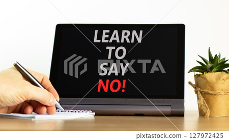 Learn to say no symbol. Concept words phrase Learn to say no on beautiful black tablet. Businessman's hand. Beautiful white background. Business psychological Learn to say no concept. Copy space. Learn to say no symbol. Concept words phrase Learn to say no on beautiful black tablet. Businessman's hand. Beautiful white background. Business psychological Learn to say no concept. Copy space. 127972425
