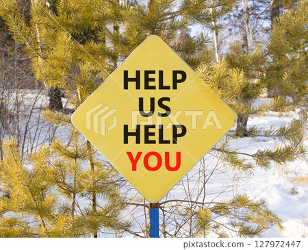 Help you symbol. Concept words phrase Help us help you on beautiful yellow road sign. Beautiful winter forest background. Business Help you concept. Copy space. 127972447