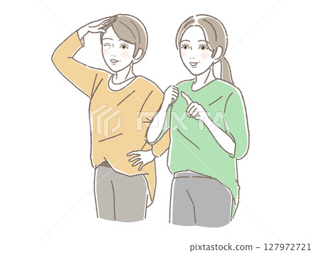 Two middle-aged women smiling and looking into the distance 127972721