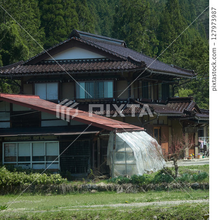 Spring Japanese countryside farm house and nature scenery 127973987
