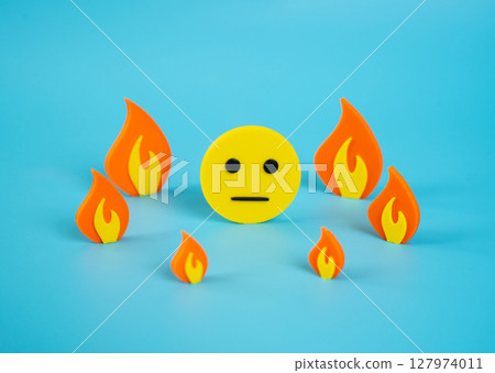 Indifferent face surrounded by fire. Indifference to surrounding events and lack of reflection. Public fatigue, media saturation, or disconnect between personal wellbeing and external turmoil. Indifferent face surrounded by fire. Indifference to surrounding events and lack of reflection. Public fatigue, media saturation, or disconnect between personal wellbeing and external turmoil. 127974011