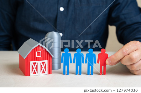 The man resolves the labor shortage in the agricultural sector. Workforce management in rural areas, hiring migrants, or promoting agri-robotics. Global food supply issues The man resolves the labor shortage in the agricultural sector. Workforce management in rural areas, hiring migrants, or promoting agri-robotics. Global food supply issues 127974030