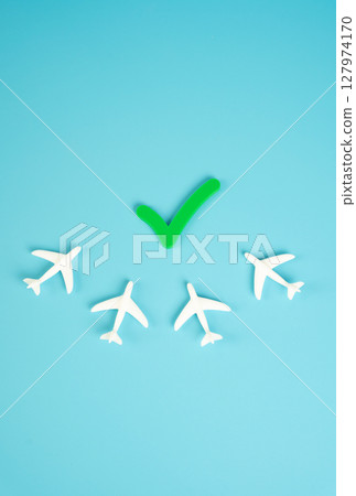 Airplanes and the permission tick. Lifting emergency measures and permission to fly. Recovery in aviation, post-pandemic normalization, or relaxation of travel restrictions. Airplanes and the permission tick. Lifting emergency measures and permission to fly. Recovery in aviation, post-pandemic normalization, or relaxation of travel restrictions. 127974170