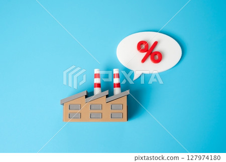 Industrial factory expresses concern about interest. High taxes or debts. Surcharge. Additional cost. Financial strain in manufacturing sector. Rising interest rates, tax burdens, or operational costs 127974180