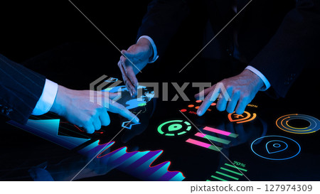 Corporate professionals use illuminated global interface for strategic data analysis. Global business 127974309