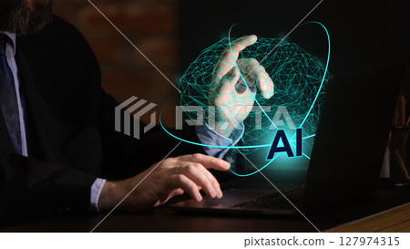 Businessman interacting with glowing 3D artificial intelligence hologram in digital workspace Businessman interacting with glowing 3D artificial intelligence hologram in digital workspace 127974315