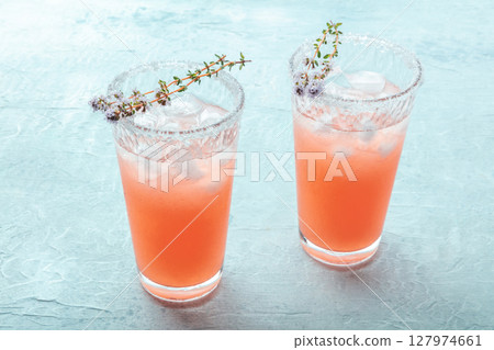 Salty Dog cocktail with fresh grapefruit juice, lime juice, and thyme Salty Dog cocktail with fresh grapefruit juice, lime juice, and thyme 127974661