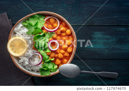 Chana masala, chickpea curry, traditional Indian dish, overhead flat lay shot 127974670