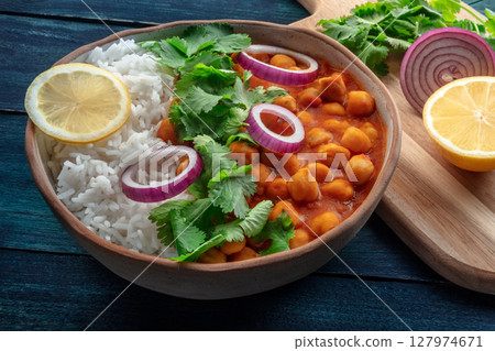 Chana masala, chickpea curry, traditional Indian dish, with ingredients Chana masala, chickpea curry, traditional Indian dish, with ingredients 127974671