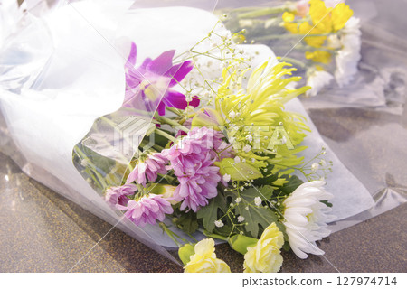Bouquets offered in memory of the deceased Bouquets offered in memory of the deceased 127974714