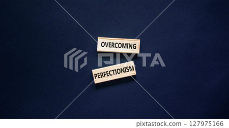 Overcoming perfectionism symbol. Concept words Overcoming perfectionism on beautiful wooden block. Beautiful black paper background. Business Overcoming perfectionism concept. Copy space. 127975166