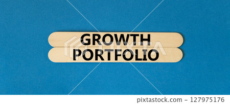 Growth portfolio symbol. Concept words Growth portfolio on beautiful wooden stick. Beautiful blue paper background. Business Growth portfolio concept. Copy space. 127975176