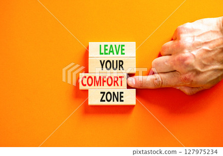 Leave your comfort zone symbol. Concept words Leave your comfort zone on beautiful wooden blocks. Beautiful orange paper background. Business psychological Leave your comfort zone concept. Copy space. Leave your comfort zone symbol. Concept words Leave your comfort zone on beautiful wooden blocks. Beautiful orange paper background. Business psychological Leave your comfort zone concept. Copy space. 127975234