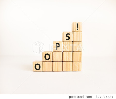 Oops symbol. Concept word Oops on beautiful wooden blocks. Beautiful white table white background. Business lifestyle oops concept. Copy space. Oops symbol. Concept word Oops on beautiful wooden blocks. Beautiful white table white background. Business lifestyle oops concept. Copy space. 127975285