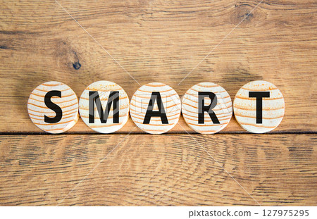 Smart symbol. Concept word Smart on beautiful wooden circles. Beautiful wooden table wooden background. Business lifestyle smart concept. Copy space. Smart symbol. Concept word Smart on beautiful wooden circles. Beautiful wooden table wooden background. Business lifestyle smart concept. Copy space. 127975295