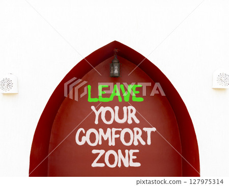 Leave your comfort zone symbol. Concept words Leave your comfort zone on beautiful brown wall. Beautiful white wall background. Business psychological Leave your comfort zone concept. Copy space. Leave your comfort zone symbol. Concept words Leave your comfort zone on beautiful brown wall. Beautiful white wall background. Business psychological Leave your comfort zone concept. Copy space. 127975314