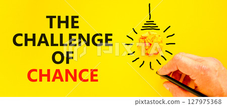 The challenge of chance symbol. Concept words phrase The challenge of chance on beautiful paper. Businessman's hand. Beautiful yellow background. Business The challenge of chance concept. Copy space. 127975368